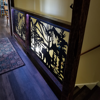 Custom designed stair railing panels are plasma cut with highly intricate detail and powder-coated to compliment any decor