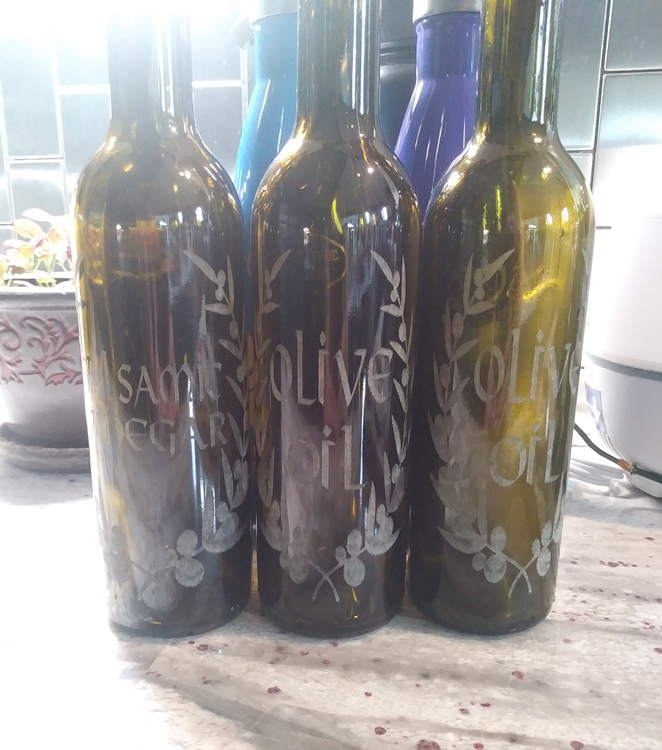 WildMtn Innovations designed these laser etched glass olive oil bottles